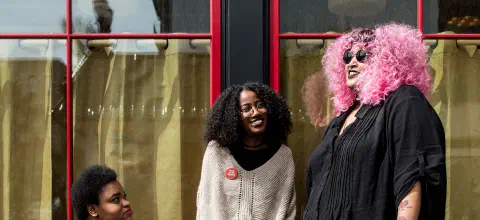 Disabled people of color hanging out outdoors together