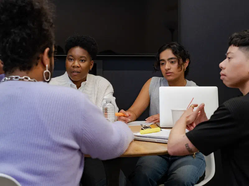 Group of co-workers of varying genders having a meeting