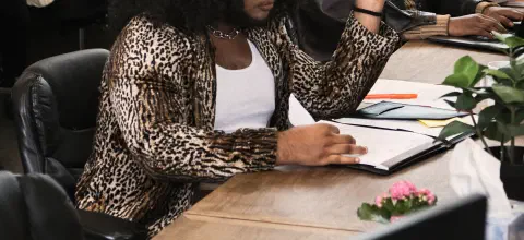 Group of people of varying genders working in an office