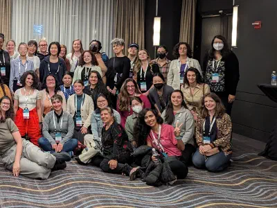 R-Ladies community members gathered in a room of the Hyatt in Chicago at the conclusion of the Q&A session.
