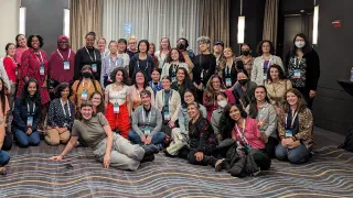 R-Ladies community members gathered in a room of the Hyatt in Chicago at the conclusion of the Q&A session.